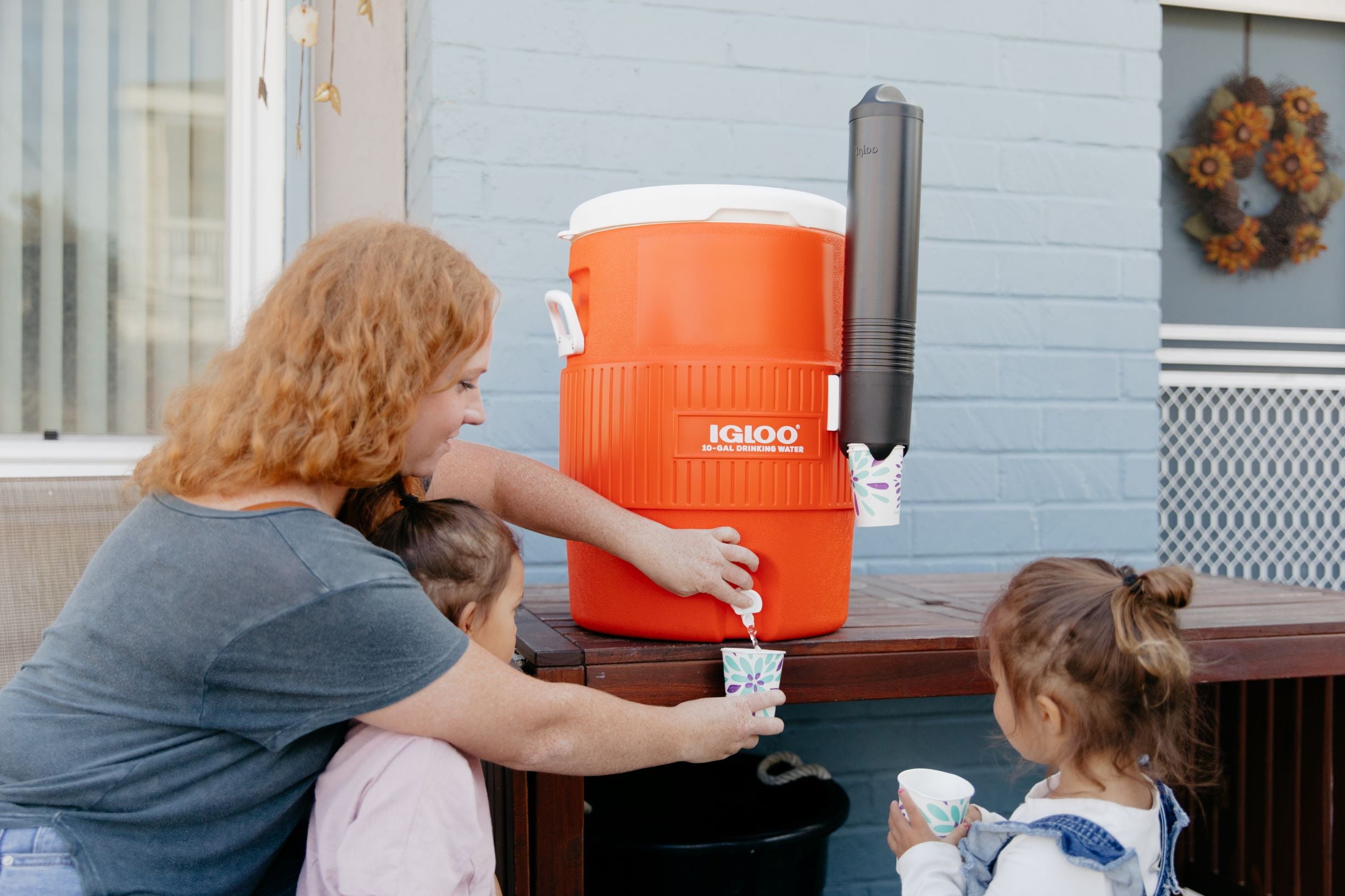 10-Gallon Seat Top Water Jug with Cup Dispenser - Orange